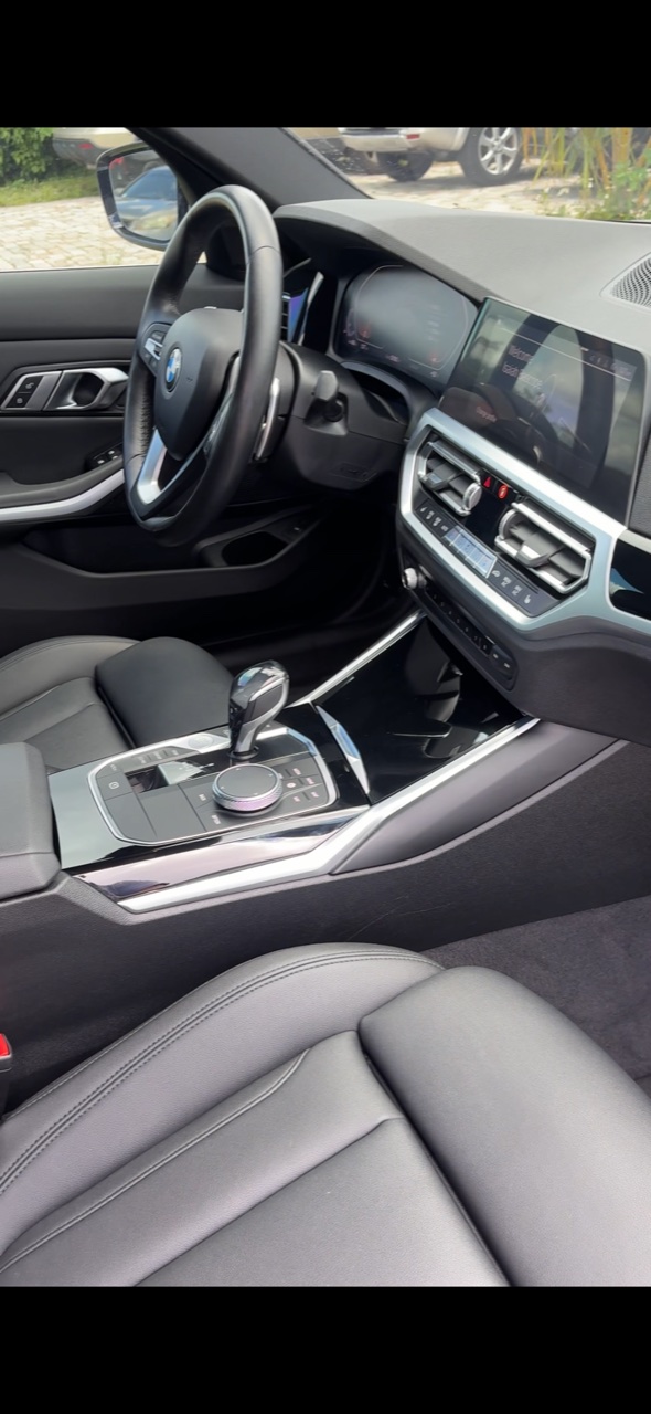 Detailed BMW interior — steering wheel, console, dashboard