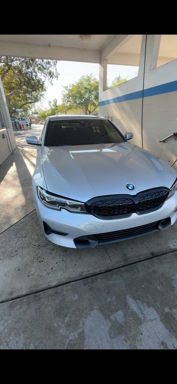Silver BMW 3-Series freshly washed